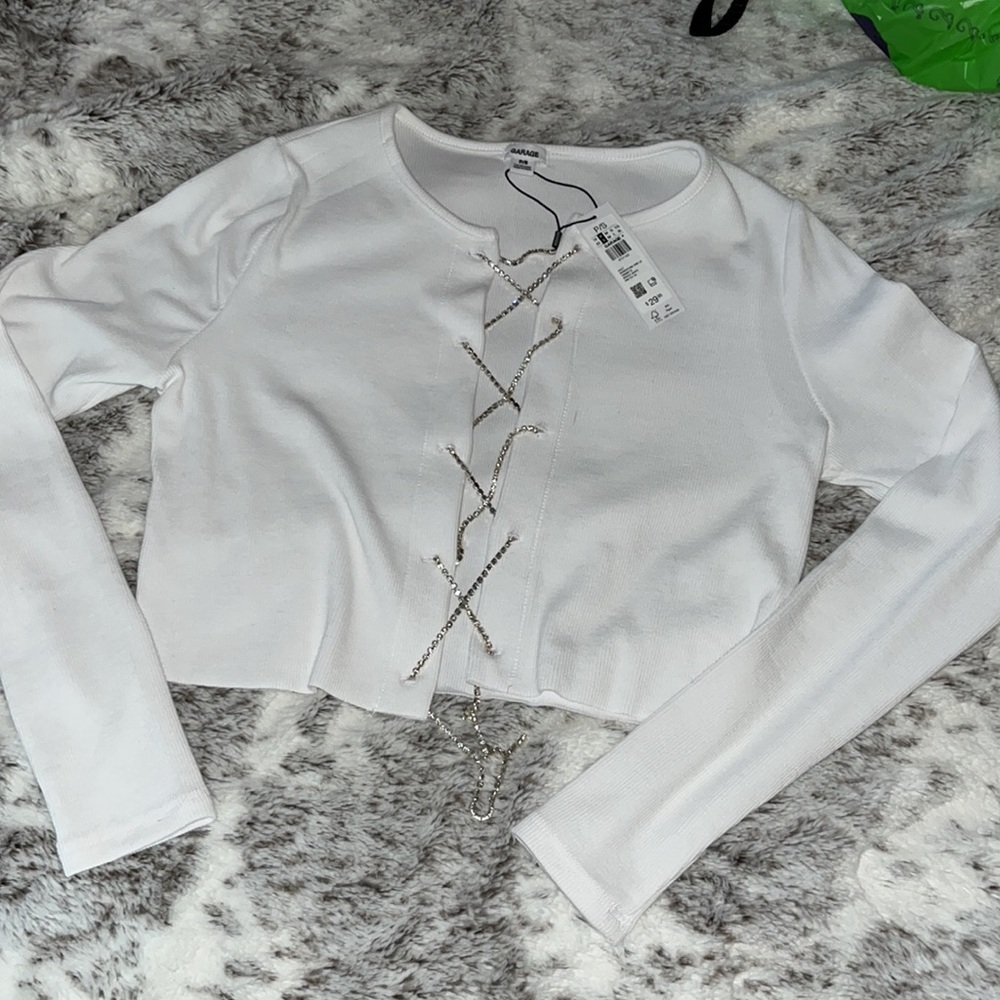 White ribbed top, open front with crystal weaves. NEW WITH TAGS